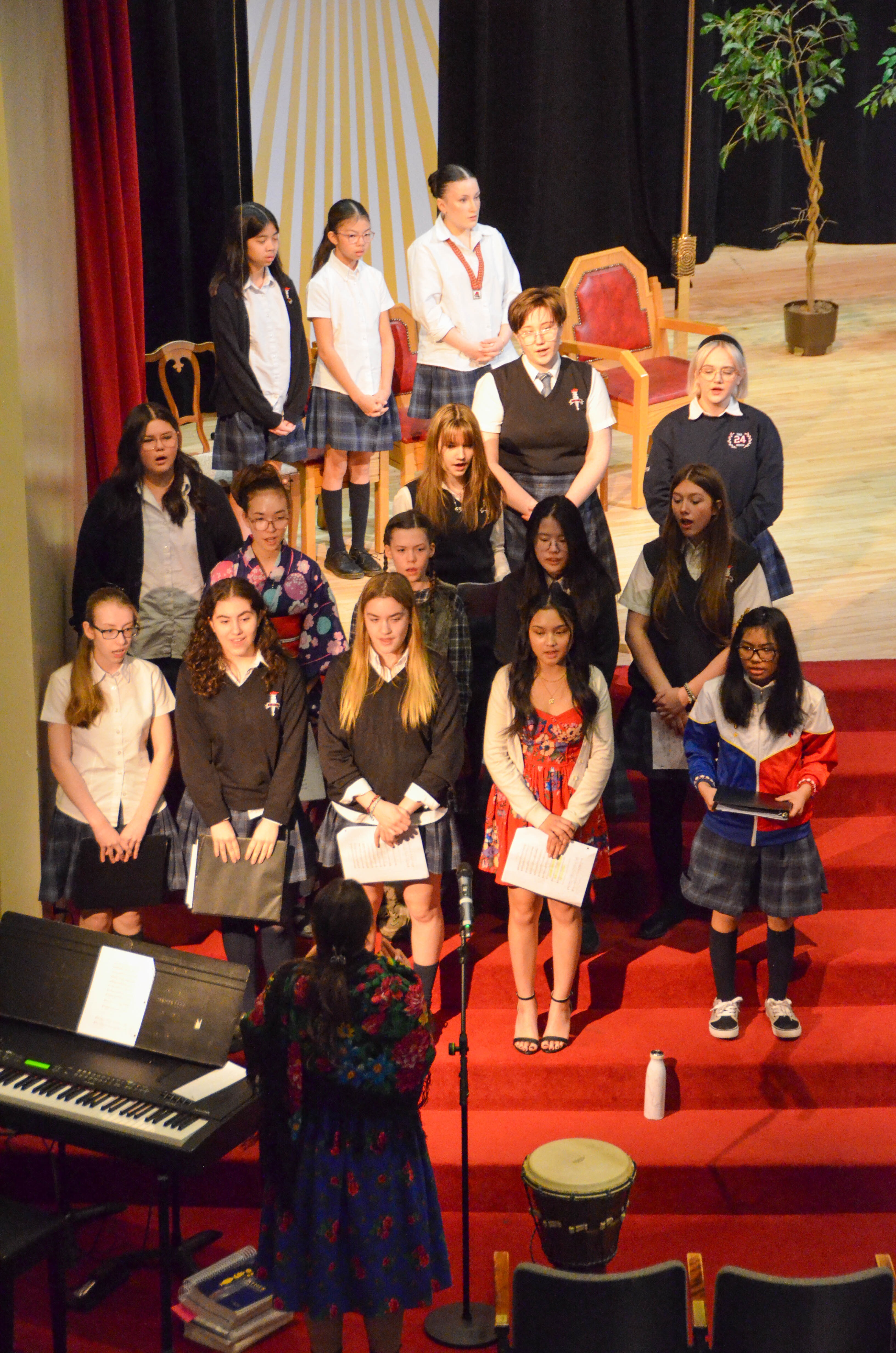 A group of St. Mary's Academy students perform on stage at the school's annual spring concert.