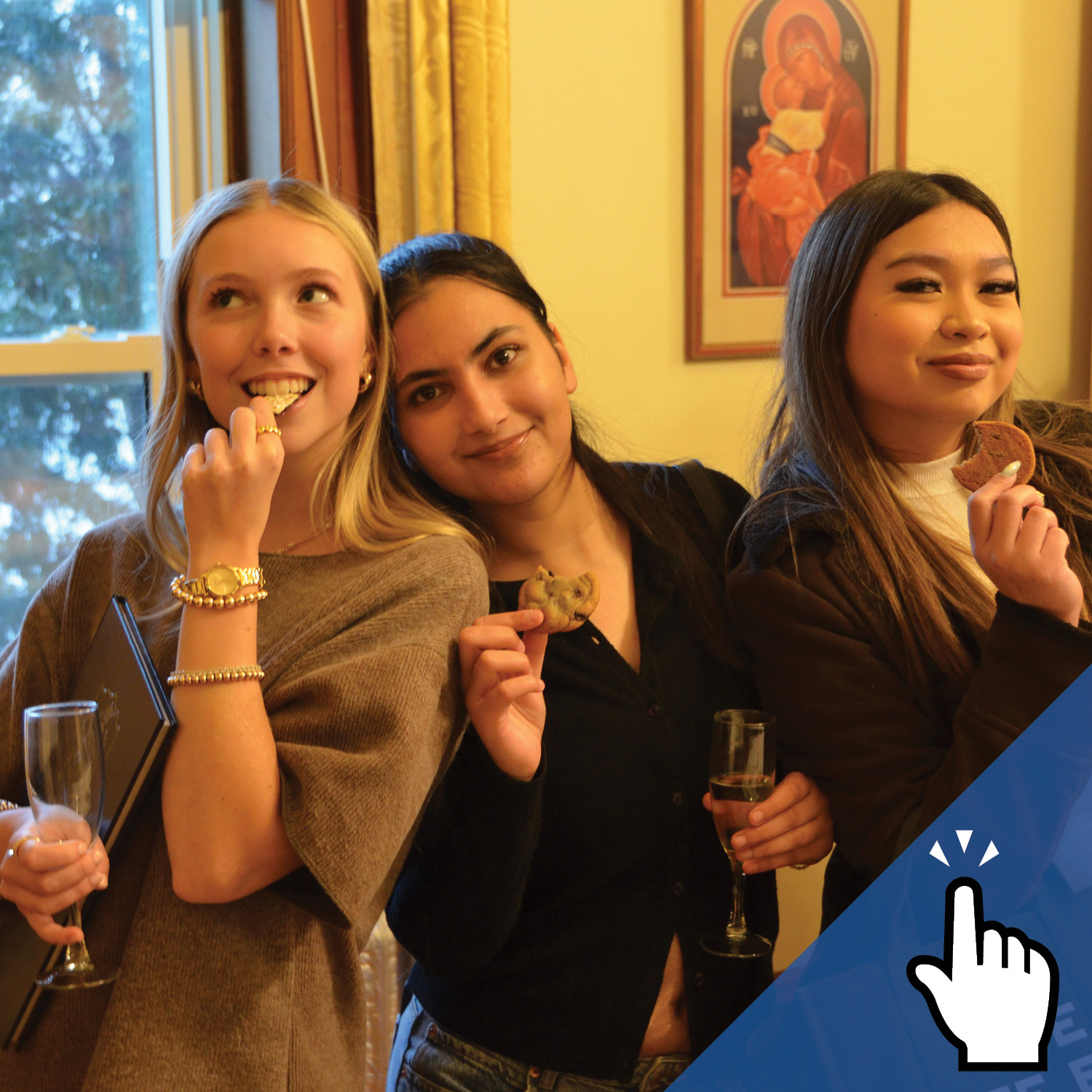 Three St. Mary's Academy alumnae posing and holding a drink and snacks in their hands.