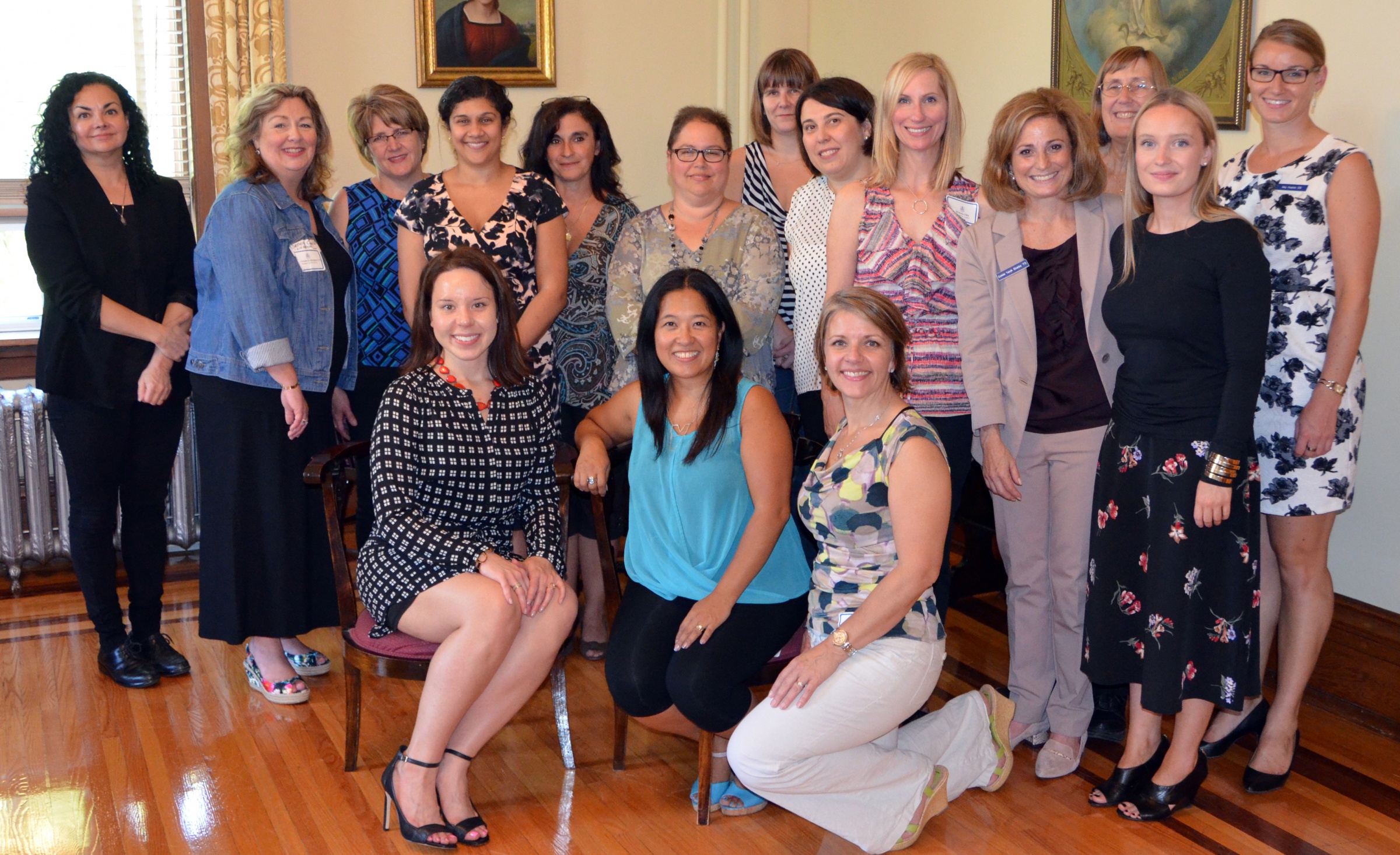 A group of smiling St. Mary's Academy alumnae.