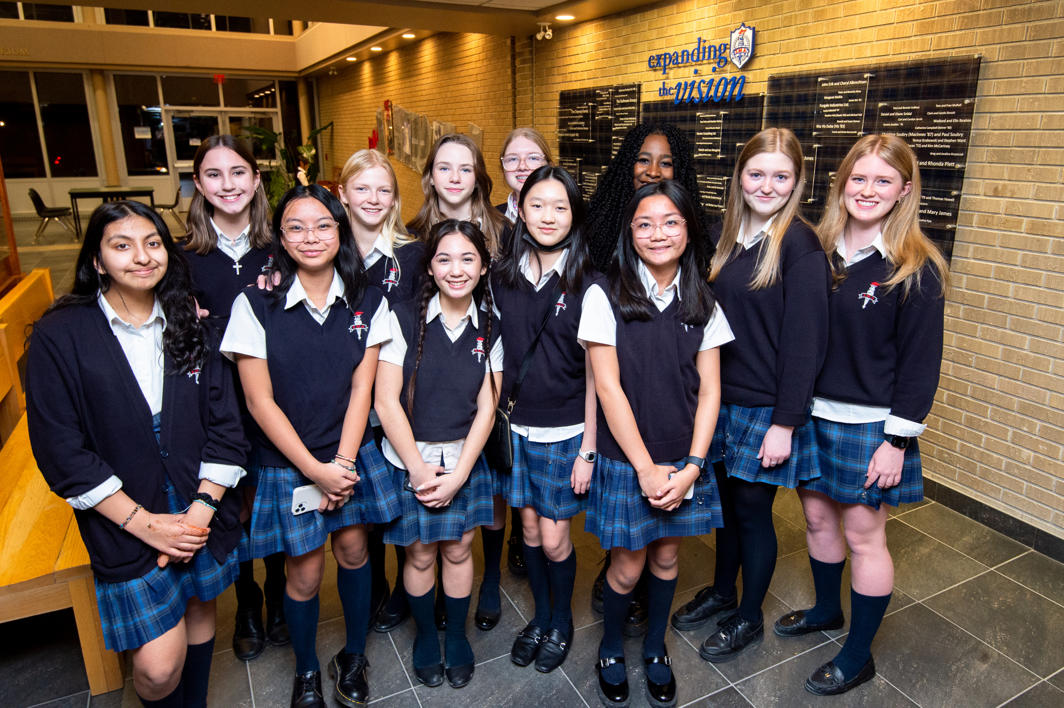 A group of St. Mary's Academy wear their school uniforms.