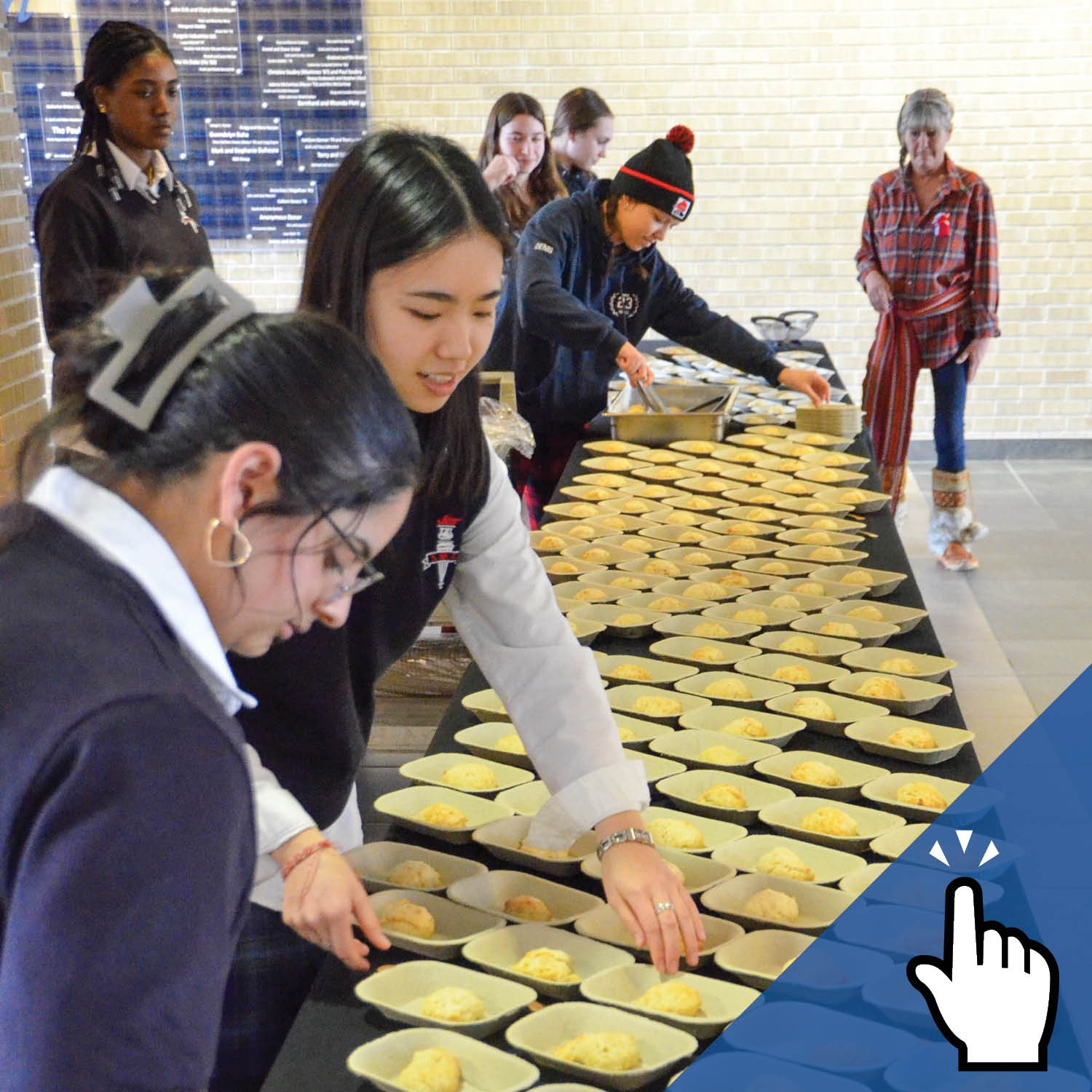 a group of students serve bannock